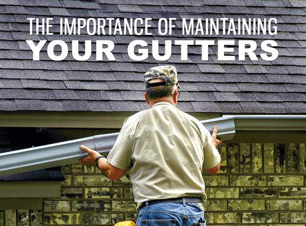 Man installing gutters for the house