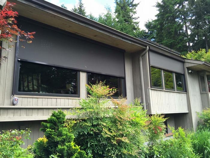 house with screens half retracted