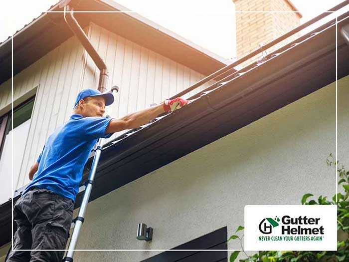 Professional installing a gutter